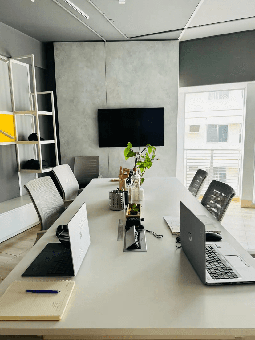 Technyx team meeting with presenter standing and discussing with colleagues